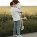A man holding a woman on the side of a road