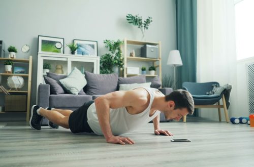 a man is doing push ups on the floor